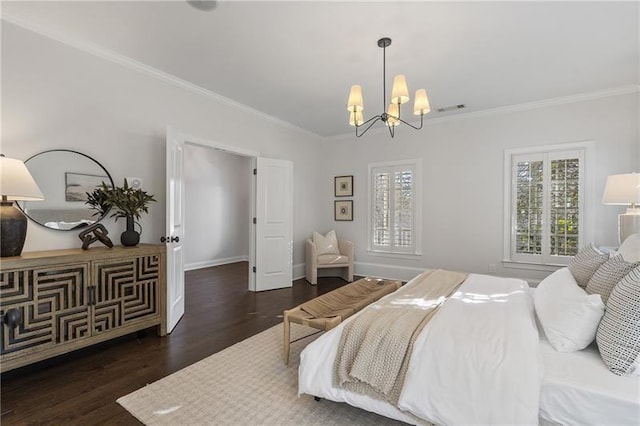 bedroom with crown molding, dark hardwood / wood-style flooring, and a notable chandelier