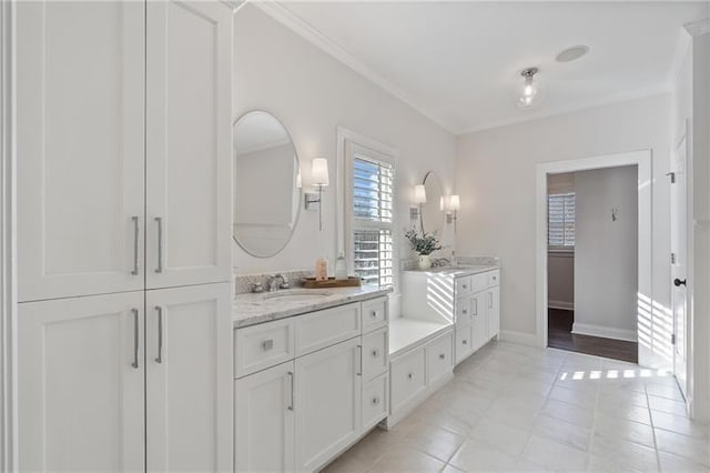 bathroom featuring vanity, crown molding, and tile patterned floors