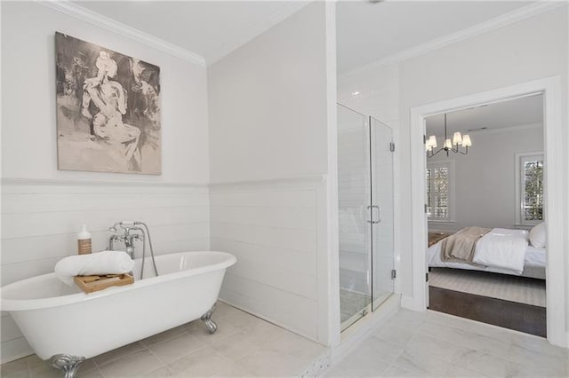 bathroom featuring ornamental molding, plus walk in shower, and a chandelier