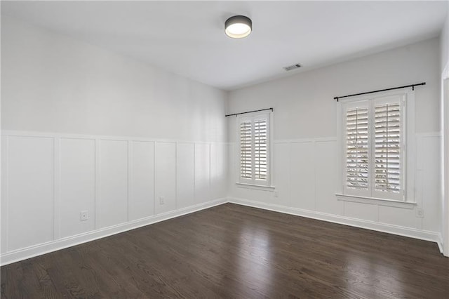 empty room featuring dark hardwood / wood-style floors