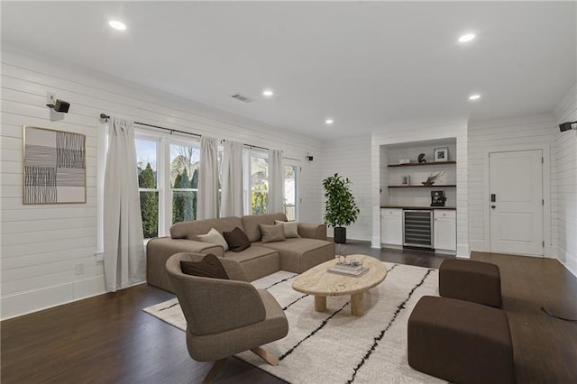 living room with wine cooler and dark hardwood / wood-style flooring