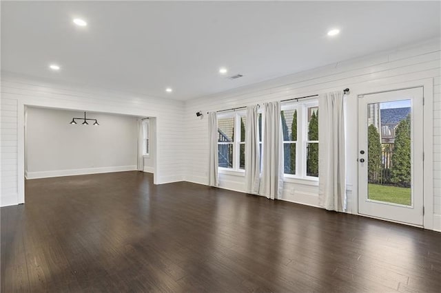 empty room featuring dark wood-type flooring