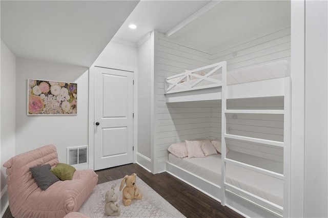 bedroom featuring dark hardwood / wood-style flooring