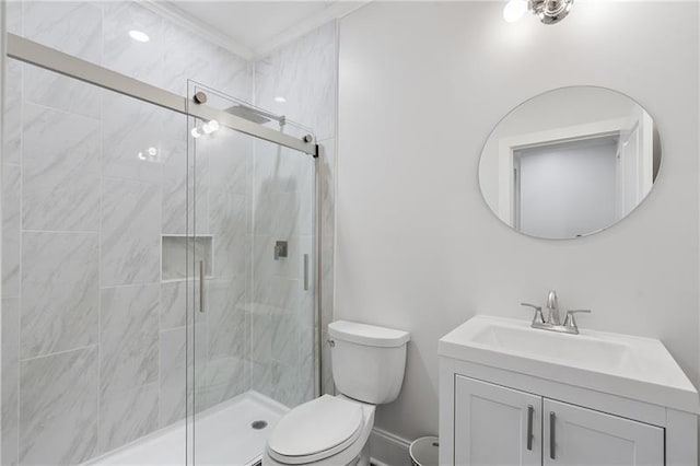 bathroom with vanity, toilet, and a shower with shower door