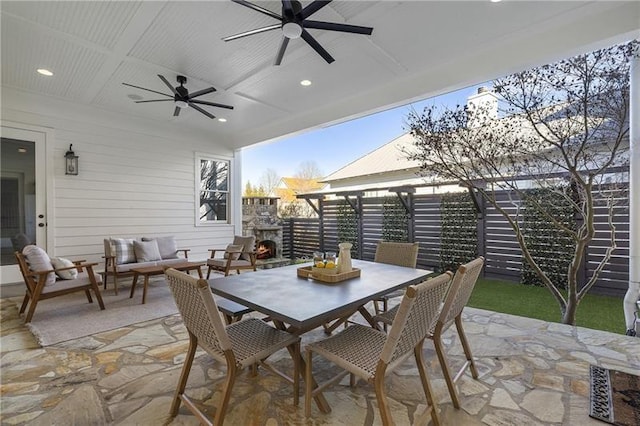 view of patio with outdoor lounge area and ceiling fan