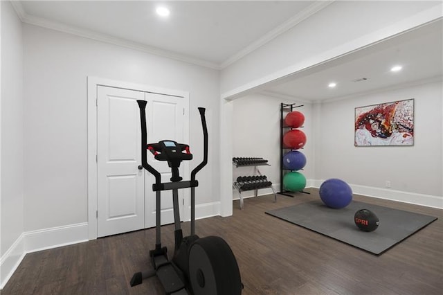 workout room with dark wood-type flooring and ornamental molding