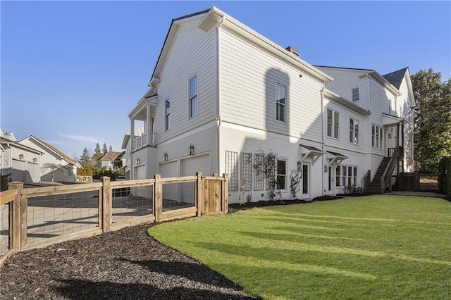 view of property exterior featuring a garage and a yard