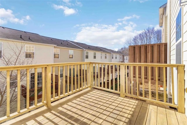 wooden terrace featuring a residential view