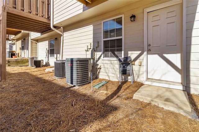 doorway to property featuring central AC unit