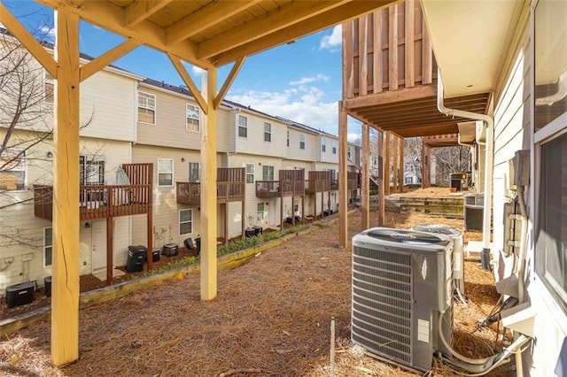 view of yard featuring a residential view and central AC