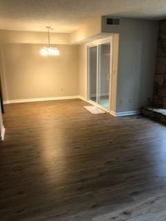 unfurnished room featuring dark wood-type flooring