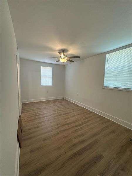 2041 Olive Springs Rd, Marietta, GA 30060 - empty room featuring dark wood-style flooring, baseboards, and ceiling fan