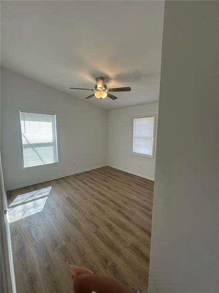 2041 Olive Springs Rd, Marietta, GA 30060 - spare room featuring ceiling fan, baseboards, and wood finished floors