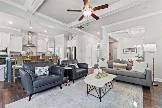 living room featuring beamed ceiling, baseboards, visible vents, and dark wood finished floors