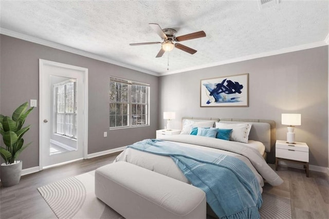 504 Mill Pond Ct, Smyrna, GA 30082 - bedroom featuring wood finished floors, access to exterior, a textured ceiling, ceiling fan, and ornamental molding