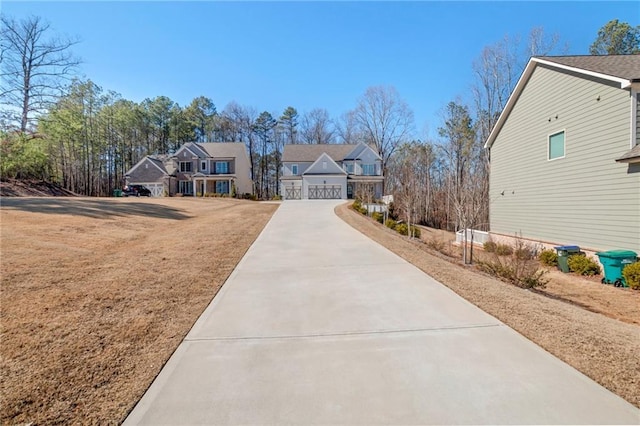 view of front of property with a garage and a front lawn