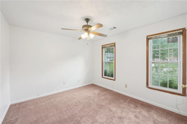 742 Redland Dr, Jonesboro, GA 30238 - carpeted spare room with plenty of natural light, baseboards, and ceiling fan