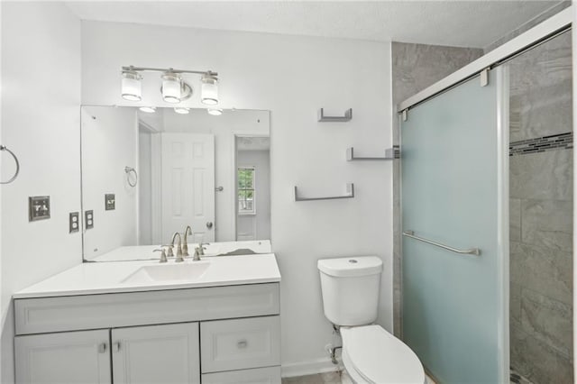 742 Redland Dr, Jonesboro, GA 30238 - bathroom with toilet, vanity, a stall shower, and baseboards