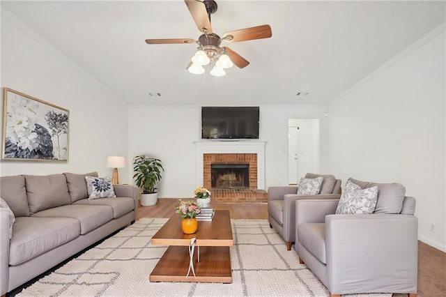 742 Redland Dr, Jonesboro, GA 30238 - living area featuring ceiling fan, crown molding, a fireplace, wood finished floors, and baseboards