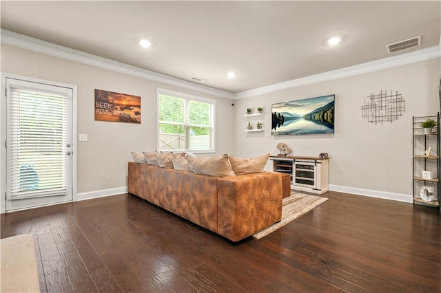 living room with crown molding, baseboards, dark wood-type flooring, and visible vents