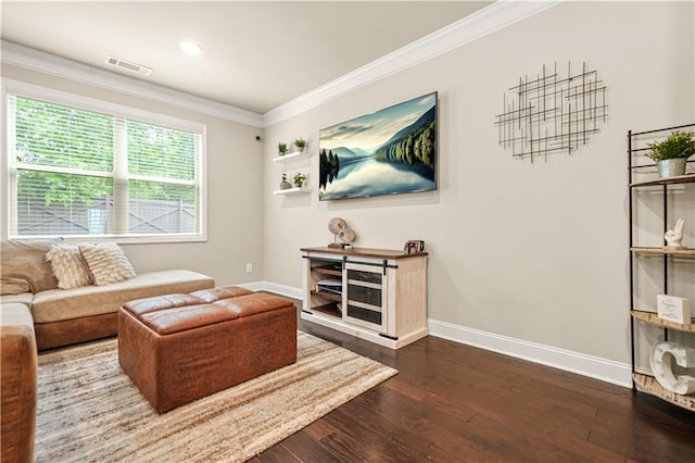 living room with baseboards, ornamental molding, dark wood-style flooring, and visible vents