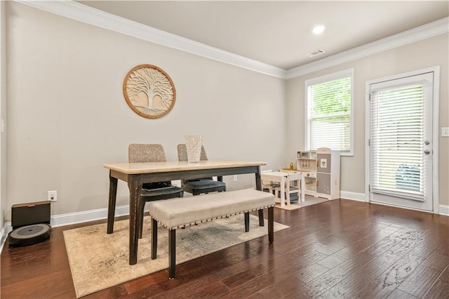 dining area featuring crown molding, baseboards, dark wood finished floors, and visible vents