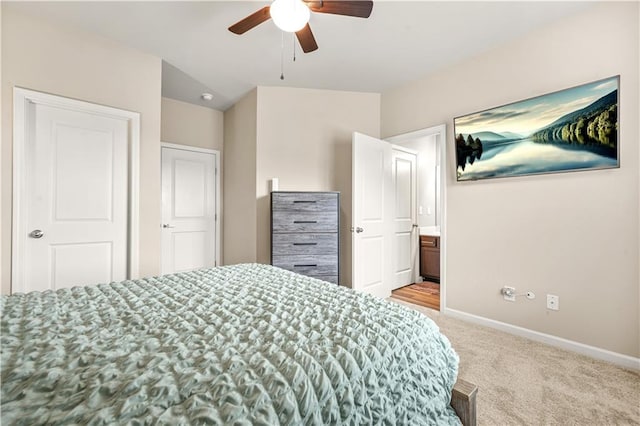 bedroom featuring baseboards, a ceiling fan, and light colored carpet