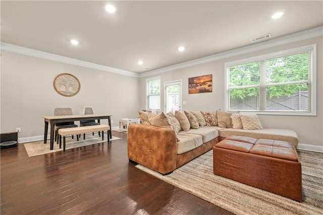 living area featuring crown molding, recessed lighting, visible vents, and dark wood finished floors