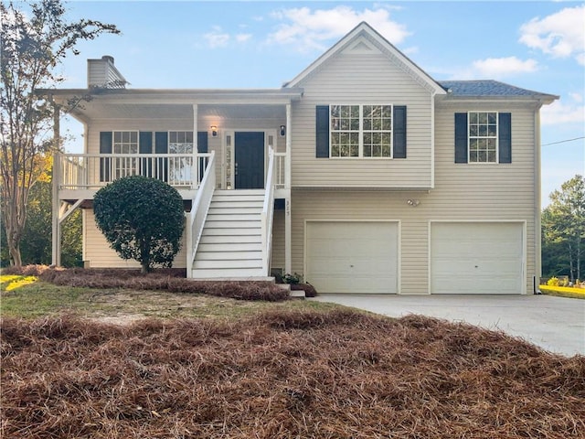 split foyer home featuring covered porch and a garage