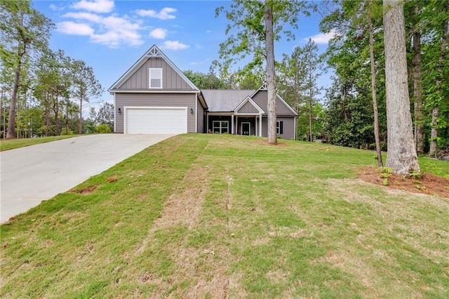 craftsman house with a garage and a front lawn