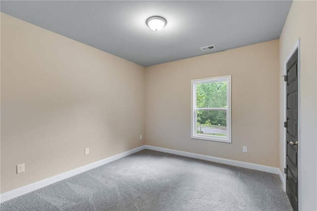 unfurnished room with carpet flooring