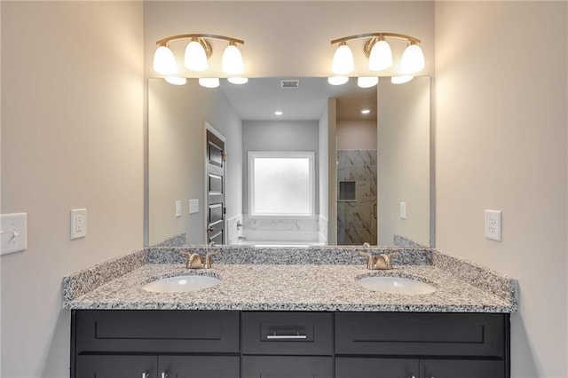 bathroom with vanity and walk in shower