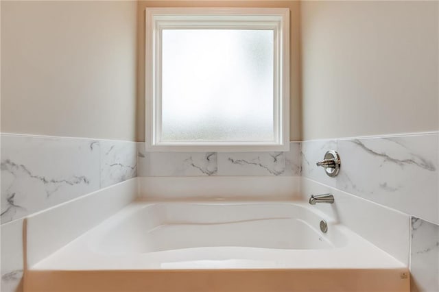 bathroom featuring a tub