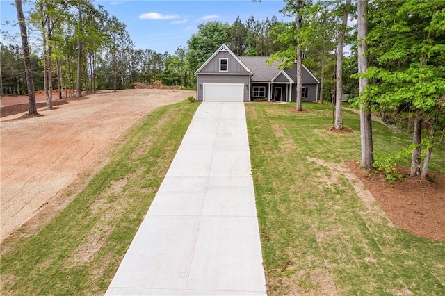 view of front of home featuring a front yard and a garage