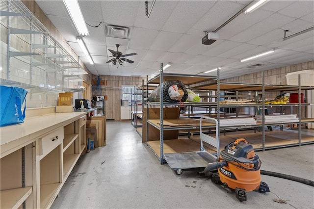 miscellaneous room featuring a drop ceiling and ceiling fan