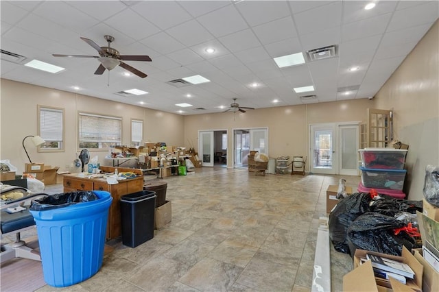 miscellaneous room with french doors, a drop ceiling, and ceiling fan