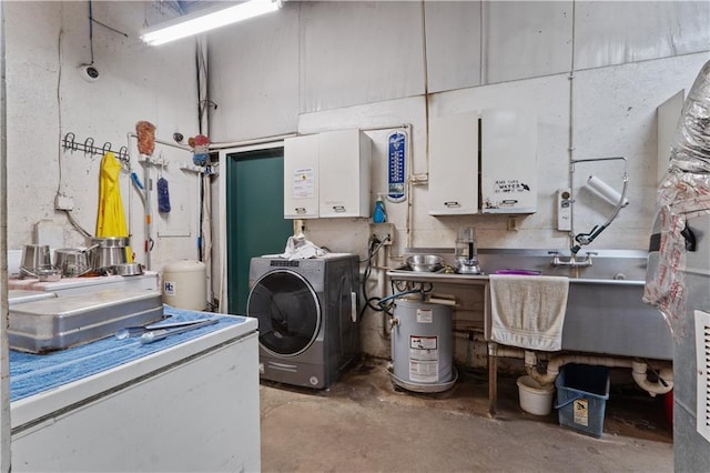 laundry area with washer / clothes dryer, water heater, and sink