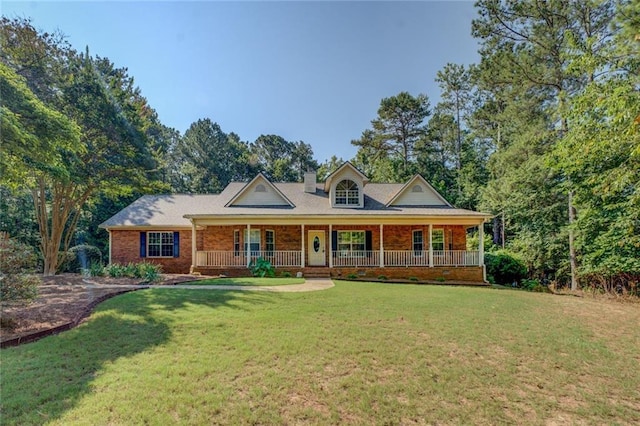 502 Brookline Pl, Mcdonough, GA 30252 - view of front of property featuring covered porch, a front yard, and brick siding