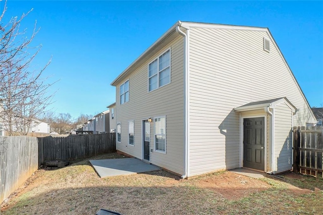 back of property with a patio area