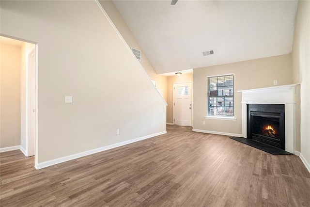 unfurnished living room featuring wood-type flooring