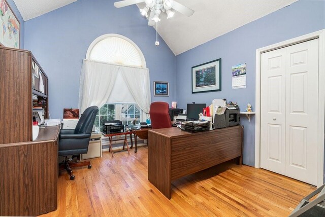 office area with ceiling fan, light hardwood / wood-style floors, and lofted ceiling