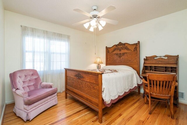 bedroom featuring ceiling fan and light hardwood / wood-style flooring