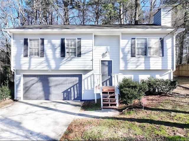 split foyer home featuring a garage