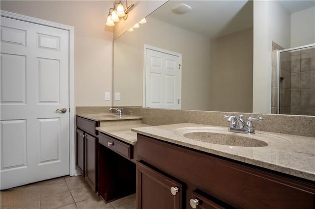 bathroom featuring tile patterned flooring, vanity, and a shower with shower door