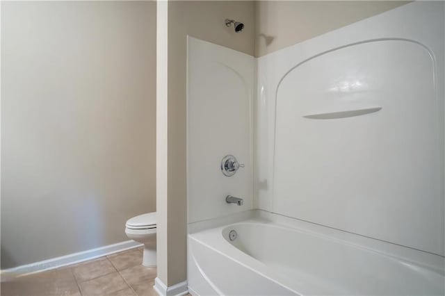 bathroom with tile patterned floors, toilet, and bathtub / shower combination