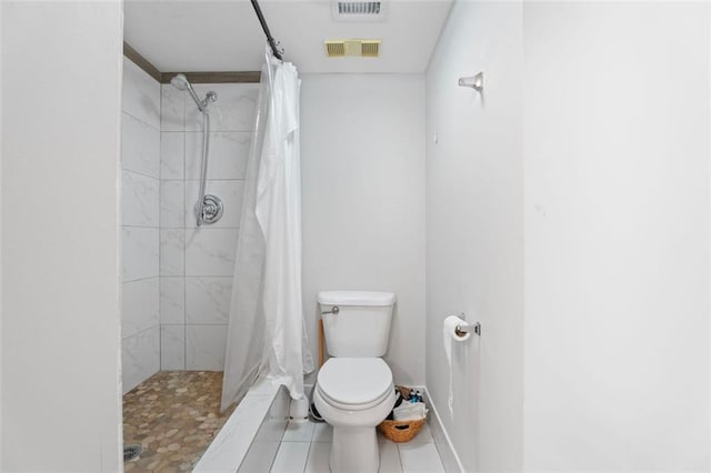 795 Hammond Dr Unit 505, Atlanta, GA 30328 - bathroom with toilet, tile patterned flooring, a shower stall, and baseboards
