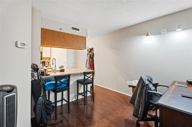 795 Hammond Dr Unit 505, Atlanta, GA 30328 - office space with dark wood finished floors, a textured ceiling, and a sink