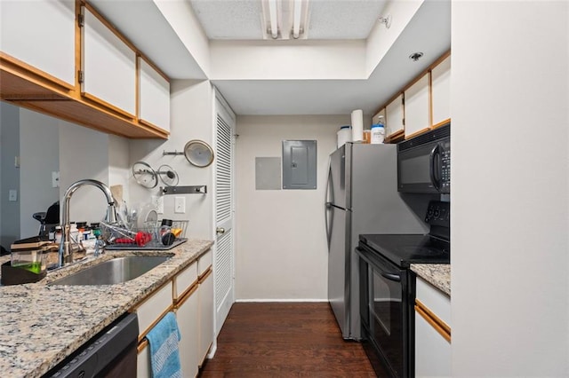 795 Hammond Dr Unit 505, Atlanta, GA 30328 - kitchen with black appliances, a sink, white cabinetry, dark wood-type flooring, and electric panel