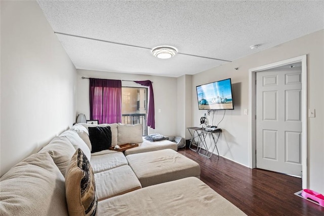795 Hammond Dr Unit 505, Atlanta, GA 30328 - living area featuring wood finished floors, a textured ceiling, and baseboards