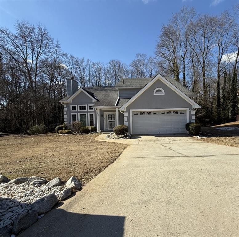 ranch-style house featuring a garage